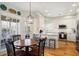 Well-lit kitchen with stainless steel appliances, white cabinetry, and a cozy dining area at 685 Trailwood Sw Ln, Marietta, GA 30064