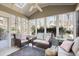 Cozy sunroom with vaulted ceilings, comfortable seating and lots of natural light at 685 Trailwood Sw Ln, Marietta, GA 30064