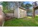 Backyard with shed and partial fence, offering extra storage and a secure outdoor space at 1353 Wilson Manor Cir, Lawrenceville, GA 30045