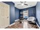 Well-lit bedroom features a ceiling fan, window, and a neutral color scheme, perfect for relaxation at 1353 Wilson Manor Cir, Lawrenceville, GA 30045