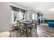 Cozy dining area with modern table set, seamlessly connected to the living room at 1353 Wilson Manor Cir, Lawrenceville, GA 30045