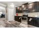 Well-equipped kitchen with modern stainless steel appliances and ample cabinet space at 1353 Wilson Manor Cir, Lawrenceville, GA 30045