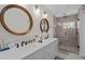 Bright bathroom featuring double sinks, lots of counter space, and a luxurious shower at 495 Woodlawn Ave, Atlanta, GA 30318