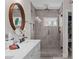 Clean and modern bathroom featuring double sinks, lots of counter space, and a luxurious shower at 495 Woodlawn Ave, Atlanta, GA 30318