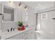 Stylish bathroom with a double sink vanity, white subway tile, and elegant fixtures, blending modern comfort with classic design at 495 Woodlawn Ave, Atlanta, GA 30318