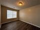 Cozy bedroom with modern flooring and natural light from a window at 5488 Wexford Pass, Atlanta, GA 30349