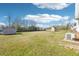 Expansive backyard with lush green grass and two storage sheds, perfect for outdoor activities at 80 Brownsville Ext., Powder Springs, GA 30127