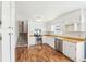 Well-lit kitchen featuring stainless steel appliances, wooden countertops, and sleek white cabinetry at 80 Brownsville Ext., Powder Springs, GA 30127