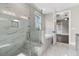 A bright bathroom featuring a glass-enclosed shower and soaking tub at 1360 Flora Dr, Conyers, GA 30094