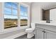 Modern bathroom with large window providing an outdoor view at 1360 Flora Dr, Conyers, GA 30094