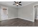 A spacious bedroom featuring hardwood flooring and lots of natural light at 1360 Flora Dr, Conyers, GA 30094