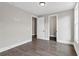 An expansive bedroom featuring hardwood flooring, neutral paint, and recessed lighting at 1360 Flora Dr, Conyers, GA 30094