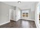 Bright bedroom with hardwood floors, a large window, and white trim at 1360 Flora Dr, Conyers, GA 30094