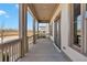 Spacious covered front porch featuring classic columns and ample space for seating at 1360 Flora Dr, Conyers, GA 30094