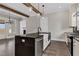 Bright kitchen featuring a kitchen island with a farmhouse sink and stainless steel appliances at 1360 Flora Dr, Conyers, GA 30094