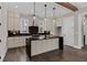 Kitchen featuring stainless steel appliances, custom cabinetry, and a large kitchen island at 1360 Flora Dr, Conyers, GA 30094