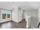Upstairs loft area with hardwood floors, natural light, and neutral gray paint at 1360 Flora Dr, Conyers, GA 30094