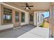 Charming covered patio with ceiling fan, ideal for outdoor entertainment and relaxation at 1360 Flora Dr, Conyers, GA 30094