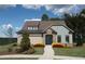 Charming single-Gathering home with stone accents, blue siding, a well-manicured lawn, and flowerbeds at 2446 Naples St, Hoschton, GA 30548