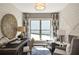 Home office featuring a dark desk, two chairs, modern decor, and a large window at 2446 Naples St, Hoschton, GA 30548