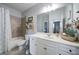 Clean bathroom with shower-tub combo and vanity. Neutral colors and great lighting at 5160 Meridian Pass, Cumming, GA 30028