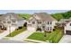 Beautiful two-story home with manicured lawn and attached two-car garage at 5160 Meridian Pass, Cumming, GA 30028