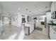 Spacious open-concept kitchen with a large island, stainless steel appliances, and lots of natural light at 5160 Meridian Pass, Cumming, GA 30028