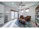 Cozy sitting area with shiplap accent wall, French doors, and abundant natural light at 5160 Meridian Pass, Cumming, GA 30028