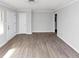 Clean, light-filled living room featuring modern flooring and fresh paint at 1042 Helen St, Forest Park, GA 30297