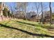 Backyard view with mature trees and play structure at 2715 Kaley Nw Ln, Kennesaw, GA 30152