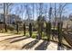 Stone patio with tall privacy hedges and view of neighboring homes at 2715 Kaley Nw Ln, Kennesaw, GA 30152