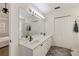 Bathroom with double sinks, a large mirror, and a separate shower area at 2715 Kaley Nw Ln, Kennesaw, GA 30152