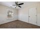Bright bedroom with neutral walls, carpet flooring, and wainscoting at 2715 Kaley Nw Ln, Kennesaw, GA 30152