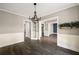 Bright dining room featuring chair rail molding, modern lighting, and hardwood floors at 2715 Kaley Nw Ln, Kennesaw, GA 30152