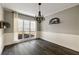 Bright dining room featuring chair rail molding, modern lighting, and hardwood floors at 2715 Kaley Nw Ln, Kennesaw, GA 30152