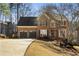 Charming two-story brick home with a well-manicured front yard and a two-car garage at 2715 Kaley Nw Ln, Kennesaw, GA 30152