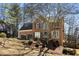 Two-story brick home featuring a two-car garage and front yard with mature trees at 2715 Kaley Nw Ln, Kennesaw, GA 30152