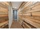 Hallway with a wood accent wall and tile flooring at 2715 Kaley Nw Ln, Kennesaw, GA 30152