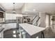 Open-concept kitchen features stainless steel appliances, an island, and flows into the living area at 2715 Kaley Nw Ln, Kennesaw, GA 30152