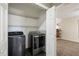 Modern washer and dryer in laundry area; shelving provides extra storage space at 2715 Kaley Nw Ln, Kennesaw, GA 30152