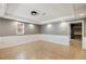 Spacious living area with neutral tones, recessed lighting, and tile flooring at 2715 Kaley Nw Ln, Kennesaw, GA 30152