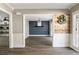 Open-concept room features a modern accent wall with an adjacent and bright living room at 2715 Kaley Nw Ln, Kennesaw, GA 30152