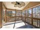 Enclosed sunroom with tile flooring and a ceiling fan, ideal for relaxing or entertaining at 2715 Kaley Nw Ln, Kennesaw, GA 30152