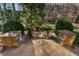 Stone steps lead to a beautifully landscaped backyard with mature trees and lush greenery at 3258 Teton Se Dr, Atlanta, GA 30339