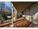 Covered deck features ample space for outdoor enjoyment and entertaining, with stairs to the backyard at 3258 Teton Se Dr, Atlanta, GA 30339