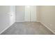 Bedroom featuring neutral walls, baseboard, and plush neutral carpeting at 5500 Marbut Forest Way, Lithonia, GA 30058