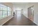 Spacious living room with hardwood floors, a brick fireplace and ample natural light at 5500 Marbut Forest Way, Lithonia, GA 30058