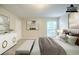 Virtually staged primary bedroom showcasing neutral colors and natural light at 5500 Marbut Forest Way, Lithonia, GA 30058
