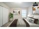 Virtually staged primary bedroom featuring neutral walls, a window, and neutral carpeting at 5500 Marbut Forest Way, Lithonia, GA 30058