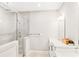 Bright bathroom featuring a glass-enclosed shower, modern fixtures, and a sleek vanity with storage space at 677 Brennan Dr, Decatur, GA 30033